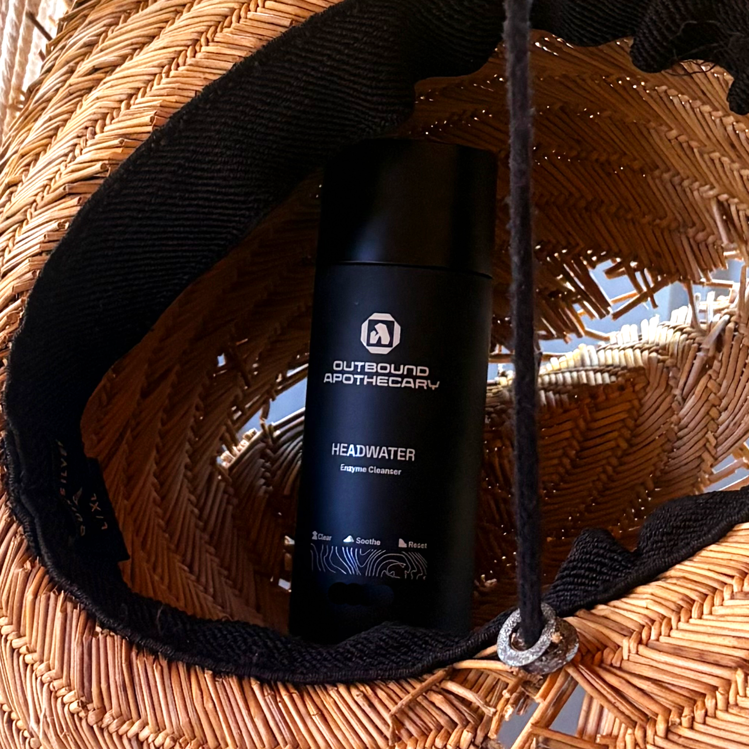 HEADWATER bottle in a straw hat
