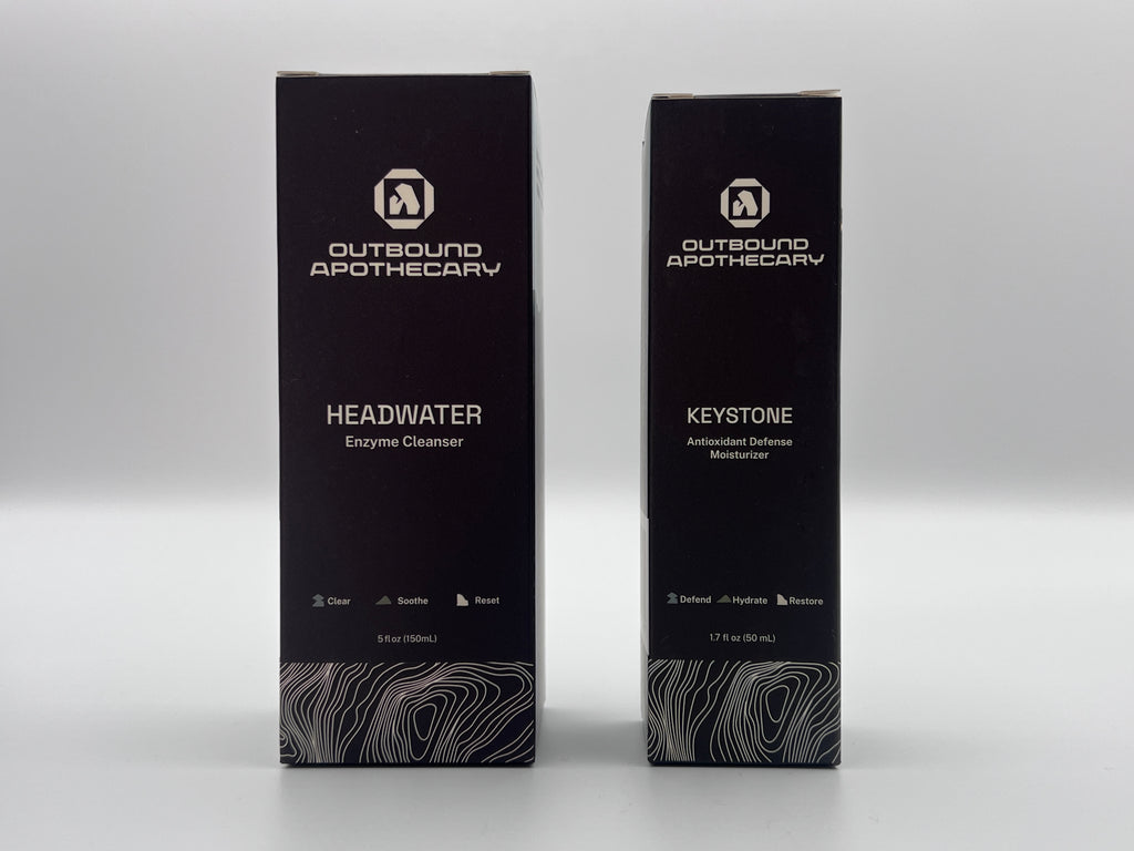Two black boxes from Outbound Apothecary on a white background